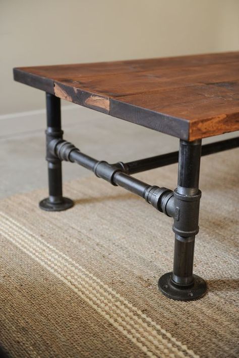 Turn some plumbing supplies and a couple of old planks into a great rustic industrial style coffee table. #diy #home #decor Rustic Industrial Coffee Table, Industrial Style Coffee Table, Koti Diy, Style Coffee Table, Industrial Coffee, Pipe Furniture, Industrial Coffee Table, Industrial Pipe, Industrial Table