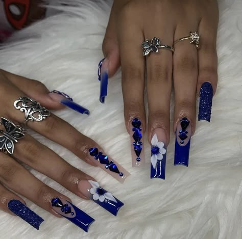 Blue Nail Designs Long Square, Royal Blue White And Silver Sweet 16, Royal Blue Acrylic Nails With Initial, Royal Blue Nails With Charms, Royal Blue Bling Acrylic Nails, Long Acrylic Nails Royal Blue, Dark Blue Quinceanera Nails, Royal Blue Nails Acrylic Medium, Royal Blue Sweet 16 Nails