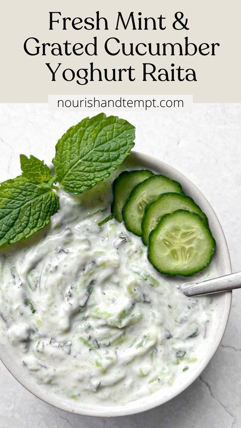 A bowl of raita topped with cucumber slices and a fresh mint sprig Cucumber Raita Recipe Indian, Raita Recipe Indian, Cucumber Mint Salad, Cucumber Raita Recipe, Healthy Dressings, Mint Raita, Raita Recipe, Indian Side Dishes, Cucumber Raita