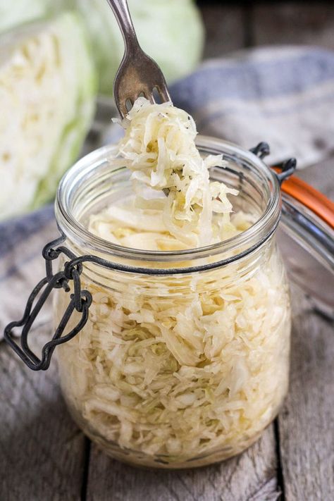 How to make Simple Cultured Cabbage!  Aka Sauerkraut- a delicious tangy addition to many dishes. Brimming with gut-healing probiotics, fermented cabbage is easy to make at home with just two ingredients! Making Sauerkraut, Fermented Sauerkraut, Homemade Sauerkraut, Healthy Probiotics, Fermented Cabbage, Sauerkraut Recipes, Fermentation Recipes, Vegetarian Cabbage, Probiotic Foods