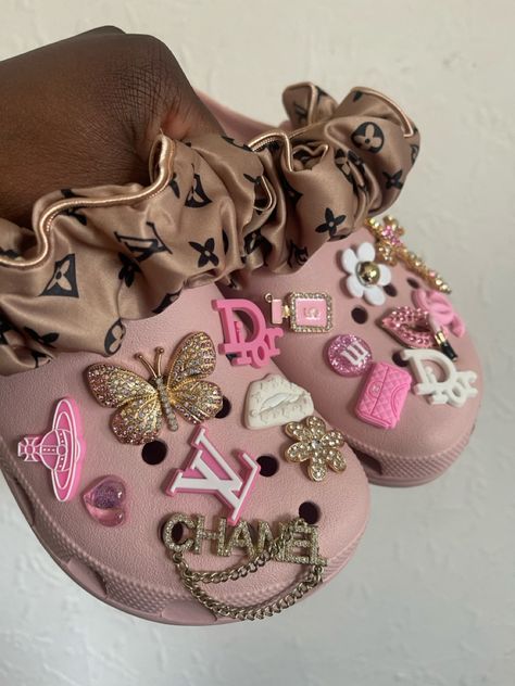 Pink custom crocs, boho, girly , jibbitz crocs, bling crocs, inspired crocs, croc charms #fashion #aesthetic #coquette #style Junk Crocs, Diy Croc Charms, Coquette Crocs, Crocs Charms Aesthetic, Pink Crocs Aesthetic, Croc Inspiration, Customized Crocs Shoes, Cute Crocs Shoes, Dolphin Nails