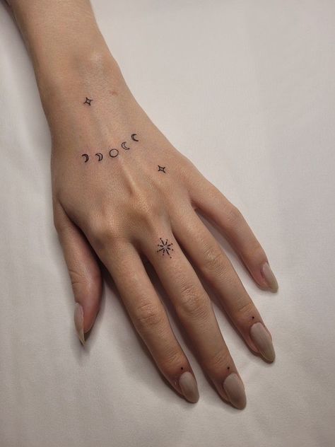 #tattoo, #tattoos, #inked, #tattooart, #tattooedwomen, #tattooedguys, #tattooinspiration, #tattooideas, #tattooworldwide, #tattoosociety, #InkLaughs, and #TattooFails​ Moon Finger Tattoo Designs, Sun Moon Star Hand Tattoo, Celestial Stick And Poke, Celestial Finger Tattoos For Women, Planet Finger Tattoo, Star Tattoos Hand, Ataraxia Tattoo, Hand Tattoo Minimalist, Wrist Hand Tattoo