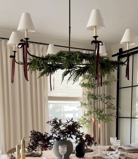 Christmas Decor Victorian House, Christmas Greenery On Chandelier, Christmas Decoration For Dining Table, Christmas Bows On Chandelier, Bows On Light Fixtures Christmas, Christmas Decorations On Chandelier, Timeless Dining Room Decor, Bows On Chandelier, Chic Christmas Table Decor