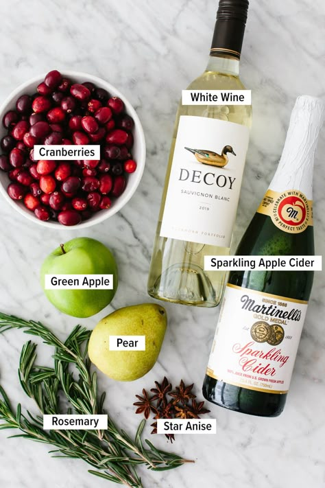 This white Christmas sangria sparkles with seasonal colors, is splashed with apple cider, and turns white wine into the best holiday drink! White Christmas Sangria, Holiday Sangria, Christmas Sangria, Holiday Beverages, Sparkling Cider, Holiday Drink, Mixed Drinks Recipes, Cocktail Drinks Recipes, Christmas Brunch