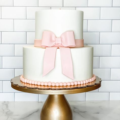 Pink Princess Birthday Aesthetic, Pink And White 1st Birthday Theme, Cake With Bow On Top, Pink Bow Baby Shower Theme Cake, Pretty In Pink 1st Birthday Party, Cake With Pink Bow, Pink And White First Birthday Cake, Baby Shower Bow Cake, Bow First Birthday Cake