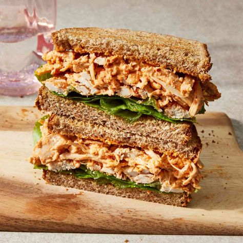 This rotisserie chicken sandwich is flavored with a dressing inspired by muhammara—a Middle Eastern sauce made from roasted red peppers, breadcrumbs, walnuts and spices. Sandwiches With Rotisserie Chicken, Rotisserie Chicken Sandwich, Chicken Sandwich Spread, Chicken Panini Recipes, Using Rotisserie Chicken, Chicken Sandwich Recipe, Chicken Panini, Eating Well Recipes, Panini Recipes