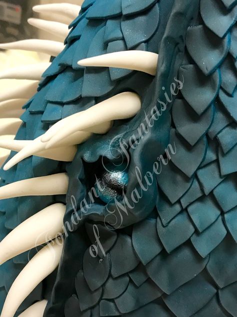 Blue tonal dragon scale cake  The eye of a dragon in cake  Visit the link below Dragon Scale Cake, Dragon Cake Ideas, Fondant Dragon, Dragon Birthday Cakes, Dragon Cake, Castle Cake, Dragon Birthday, Dragon Scales, Dragon Party