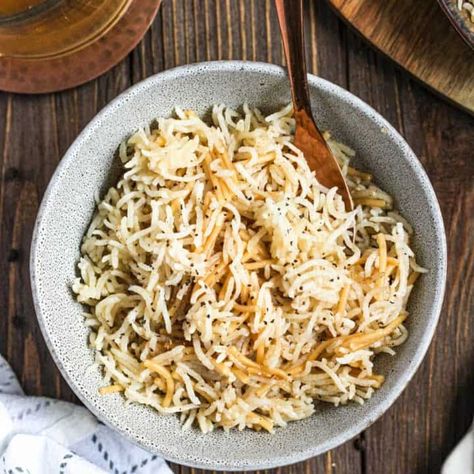 This Armenian dish with Vermicelli rice can be thrown together with ingredients that I almost guarantee are already in your pantry. Rice and pasta are browned in butter then covered in chicken stock and left to simmer for 15 minutes. A taste of Armenia has never been so easy! Armenian Rice Pilaf Recipe, Armenian Rice, Vermicelli Pasta, Vermicelli Rice, Rice Dishes Recipes, Rice Pilaf Recipe, Pilaf Recipe, Pilaf Recipes, Pigeon Peas