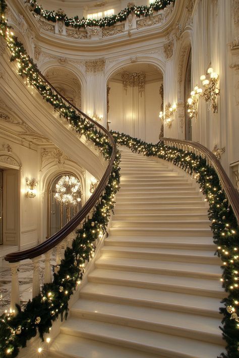 Grand staircase adorned with a festive garland of lights and greenery, complemented by elegant white marble walls in a luxurious mansion. Christmas Wonderland Indoor, Christmas Spiral Staircase, Staircase Garland Ideas, Elegant Christmas Aesthetic, Christmas Staircase Ideas, Luxury Christmas Decor Interior Design, Trending Christmas Decor 2024, Luxury Christmas Aesthetic, Cozy Christmas Bedroom Aesthetic