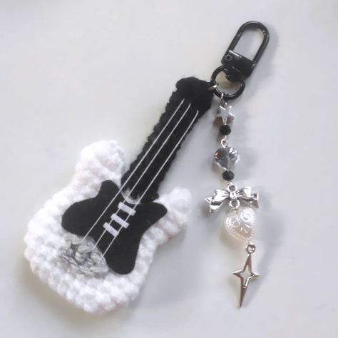 Crochet Guitar keychain 🎸💞 DM for order/enquiry The charms are made with good quality materials and stainless steel findings . . . Pattern: @chubbiesbyash . . #crochet #crochetkeychain #guitar #crochetguitar #guitarkeychain Crochet And Beads Keychain, Crochet Guitar Keychain, Crochet Projects Keychain, Easy Keychain Crochet, Crochet With Black Yarn, Key Chains Crochet, Crochet Key Chains Free Pattern, Crochet Ideas Keychain, Guitar Crochet