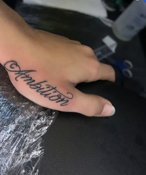 Ambition Hand Tattoo, Hand Name Tattoos For Women, Cursive Writing Tattoos, Persistence Tattoo, Lettering Hand Tattoo, Name On Hand Tattoo, Hand Name Tattoos, Name Tattoos For Men Forearm, Hayden Name