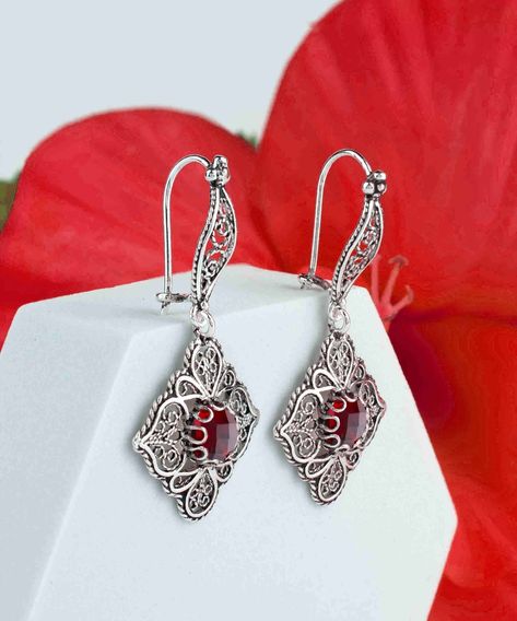 Dangle a little magic from your ears with these handcrafted Ruby Gemstone 925 Sterling Silver Earrings from FiligranUSA 🌹 With artisan filigree art and an ornate paisley design, they're a blend of elegance and bohemian chic. Perfect for making a sophisticated statement at any event! Tap into your inner enchantress and elevate your jewelry game. ✨ Click the link to adorn your lobes with these beauties ➡️ https://nuel.ink/GavyGV #RubyElegance #SilverSensation #HandcraftedGlam #FiligranUSAFind... Ruby Quartz, Female Earrings, Paisley Art, Gemstone Drop Earrings, Artisan Earrings, Statement Ring Silver, Filigree Design, Sterling Silver Filigree, Paisley Design