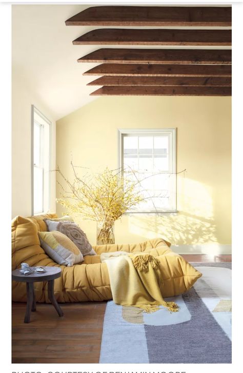 Yellow Painted Rooms Bedrooms, Moonlight Benjamin Moore, Benjamin Moore Pale Moon Paint, Pale Yellow Accent Wall, Light Yellow Walls Bedroom Ideas, Pastel Yellow Living Room, Benjamin Moore Yellow Paint Colors, Wooden Rafters, Yellow Accent Wall