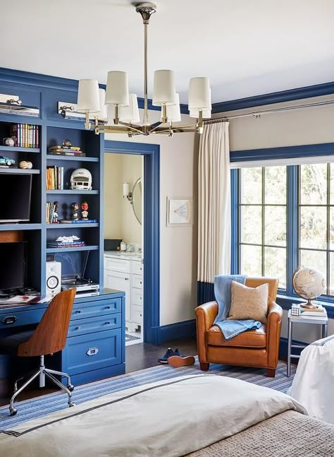 Blue and orange boys bedroom designed with a blue built-in desk and bookcase complementing blue moldings and a blue stripe rug. Boys Bedroom Orange, Boys Shared Bedroom, Boy Bedrooms, Boys Room Design, Boy Bedroom Design, Boy Rooms, Children's Bedrooms, Kid Rooms, Boys Rooms