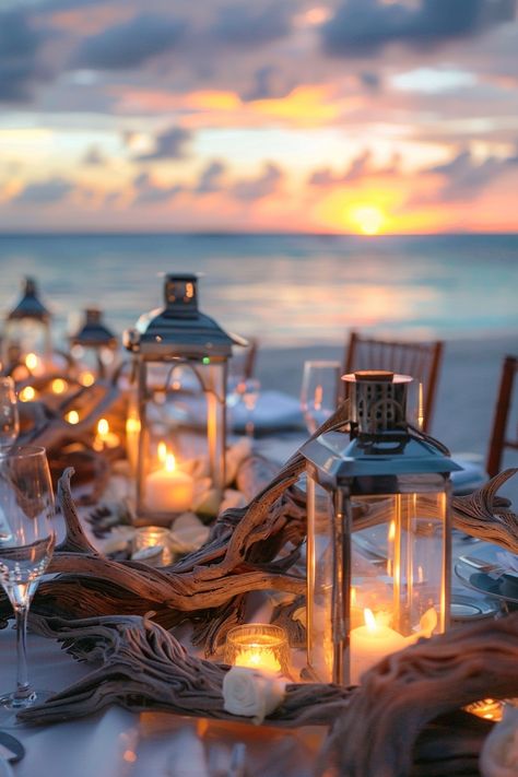 Capture the essence of love with these breathtaking wedding centerpieces. A blend of rustic driftwood and luminous lanterns create an unforgettable seaside ambiance 🌊🕯️. Perfect for brides dreaming of a beach-themed celebration 🏖️✨. #WeddingInspiration #BeachWedding #RomanticDecor #LanternCenterpieces #DriftwoodDecor #WeddingIdeas #Tablescapes #EveningGlow Beach Reception Centerpieces, Driftwood Wedding Centerpieces, Ocean Centerpieces, Beach Theme Backyard, Nautical Wedding Centerpieces, Boho Centerpiece, Beach Centerpieces, Driftwood Centerpiece, Rustic Beach Wedding