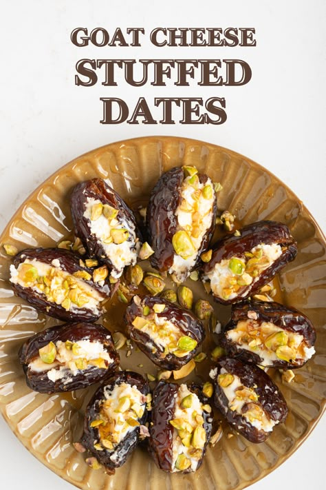 These goat cheese stuffed dates are the perfect sweet and salty appetizer that come together in 15 minutes with 5 ingredients: dates, goat cheese, honey, and pistachios. They can be enjoyed as is or baked in the oven, topped with crushed pistachios, a generous drizzle of hot honey, and fresh herbs. Roasted Dates Goat Cheese, Roasted Stuffed Dates With Goat Cheese, Appetizers With Goat Cheese Appetizer Ideas, Stuffed Dates With Goat Cheese, Baked Dates With Goat Cheese, Goat Cheese Stuffed Dates With Pistachios, Moroccan Stuffed Dates, Pistachio Stuffed Dates, Date And Goat Cheese Appetizer