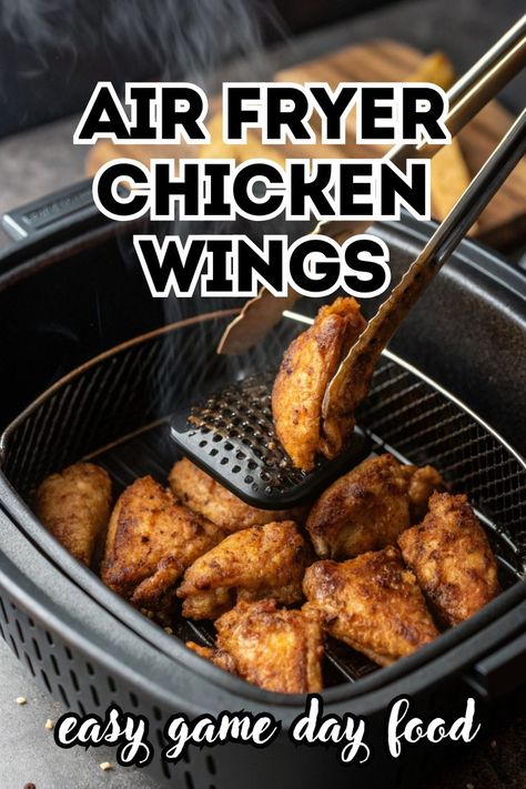 A bowl of crispy, golden brown air fryer chicken wings, garnished with sesame seeds and red pepper flakes. An air fryer is visible in the background. This easy recipe for Air Fryer Chicken Wings is the perfect appetizer for any gathering. Best Chicken Wings Airfryer, Party Wings In Air Fryer, Chicken Wings Air Fried, Ninja Foodi Air Fryer Chicken Wings, Buttermilk Chicken Wings Air Fryer, Air Fryer Hot Wings Crispy, Air Fryer Baked Chicken Wings, Ninja Air Fryer Chicken Wings, Airfry Chicken Wings Recipe