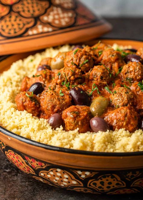 Moroccan meatballs are made with ground meat, onions, and herbs, and served with a flavorful tomato sauce. Pair with olives and couscous! Moroccan Birthday, Moroccan Meatballs, Moroccan Cooking, Moroccan Recipes, Moroccan Dishes, Filling Dinner, Middle Eastern Food, Moroccan Food, Lamb Recipes