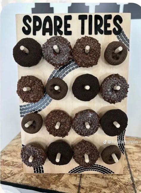 Spare Tire Donut Sign, Car Donuts Spare Tires, Donut Spare Tire, Construction Monster Truck Party, Tire Party Decorations, Old Truck Theme Birthday Party, Tire Donut Diy, Spare Tire Donut Wall, Cars And Trucks Birthday Party Decorations