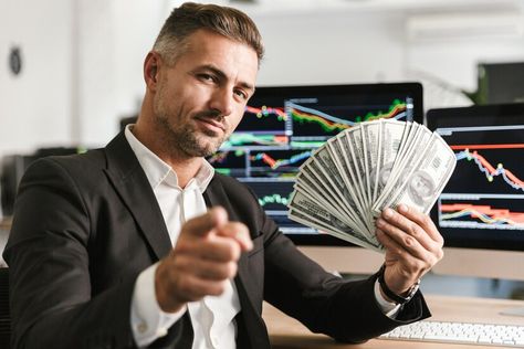 Premium Photo | Image of pleased businessman 30s wearing suit holding money fan while working in office with graphics and charts on computer Business Pictures Image, Successful Man Photography, Business Images Pictures, Guy With Money, Man With Money, Man Wearing A Suit, Men With Money, Business Man Photography, Degree Picture