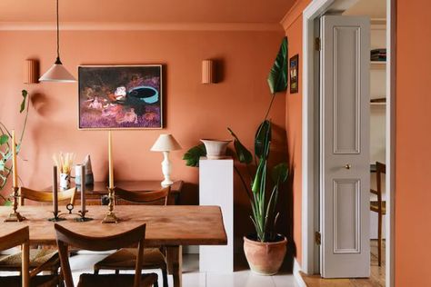 Trending on Remodelista: A Home Without Plants Is . . . - Gardenista Terracotta Dining Room, Terracotta Walls, Plaster Wall Lights, Modernist Furniture, London House, Orange Walls, Dining Room Lighting, Interior Design Studio, Room Lights