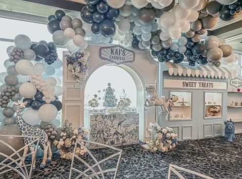 Vintage Carnival Baptism Floral and Balloon Installation Elevate your baptism reception with handcrafted floral arrangements created by the Mylofleur Floral Design team.⁠ ⁠ These blossoms symbolize purity, growth, and the divine beauty of the journey ahead.⁠ ⁠ It was the perfect touch to a world of wonder for Kai’s Vintage Carnival Baptism.⁠ ⁠ Design + Styling (Event Planner): @solizaevents⁠ Floral Installations, Arrangements, Floral Centerpieces: @mylofleurflorallv⁠ Venue: @eventsatrevere Boba Station, First Birthday Themes For Boys, Farm Themed Birthday Party, Baby Birthday Decorations, Carnival Themed Party, Baby Event, Balloon Installation, Birthday Themes For Boys, Biophilic Design