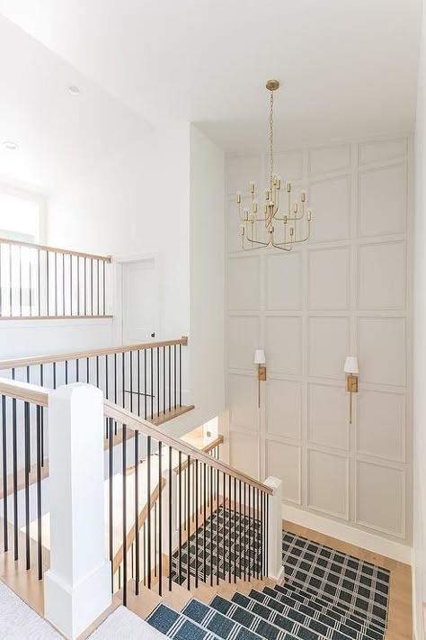 Staircase landing wall features light gray trim and brass sconces illuminating the stairs. Millhaven Homes, Staircase Landing, Staircase Wall Decor, Diy Staircase, House Staircase, Stair Wall, Staircase Remodel, Staircase Wall, Staircase Decor