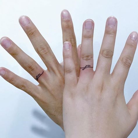 21 Chic and Stylish Ring Tattoo Designs Couple Ring Finger Tattoos, Tatoo Ring, Tattoo Rings, Finger Tattoos For Couples, Ring Tattoo Designs, Tattoos Unique Meaningful, Wedding Band Tattoo, Hand Tattoo Designs, Couple Tattoos Unique Meaningful