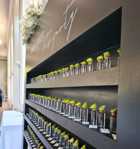 Yasmin - Wedding Planner & Florist on Instagram: "Wall of @patron 🍋🧂 ⠀⠀⠀⠀⠀⠀⠀⠀⠀ Our new show-stopping shot wall is available for individual hire, or as part of your wedding package. Perfect for showcasing your shot favours (putting them on the table is so 2021) This beauty has now been booked 4 times since it’s first outing just 4 days ago! Definitely a winner 💃🏼 We can personalise the writing, paint in any colour and have various different options available for your shots of choice and decor Shots Wall Wedding, Shot Cart Wedding, Welcome Shots Ideas, Shot Wall Party, Wedding Drink Wall, Shot Wall Wedding, Monochrome Wedding Decor, Hindu Engagement, Mexican Catering