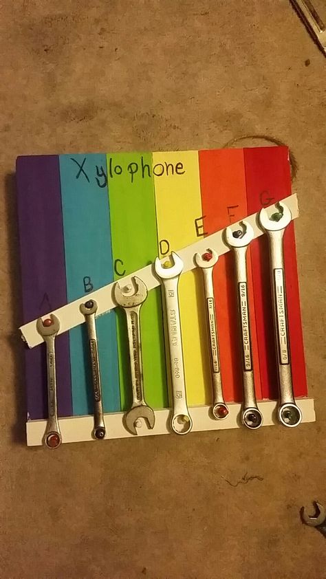 Wrench xylophone. This was super easy and fun! I went to Walmart and bought a small wood pallet, and some .50 acrylic paint, super glue, and thumb tacks. I used a tobacco stick from the garage and some wrenches we had laying around. Fun and easy! Diy Xylophone, Diy Instruments Projects, Music Instruments Diy, Homemade Musical Instruments, Homemade Instruments, Woodworking Tools For Sale, Diy Instruments, Preschool Music, Diy Musical Instruments