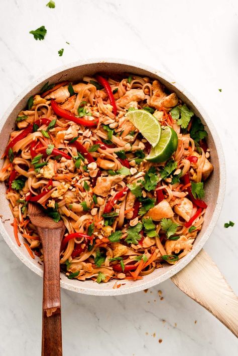 Chicken Pad Thai is a flavorful noodle stir-fry full of vegetables, chicken, rice noodles, eggs, and peanuts in a sweet and savory sauce. Make this popular dish at home in just 30 minutes! #thaifood #stirfry #asianrecipe | GarnishandGlaze.com Spicy Chicken Pad Thai, Pork Pad Thai, Egg Noodle Stir Fry, Veggie Pad Thai, Chicken Rice Noodles, Thai Chicken Noodles, Chicken Stir Fry With Noodles, Coconut Curry Shrimp, Peanut Curry