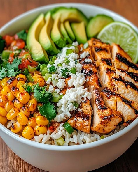 Learn how to make this easy Street Corn Chicken Rice Bowl with grilled chicken, cilantro-lime rice, and creamy street corn. A perfect meal Grilled Chicken Rice Recipes, Grilled Chicken Bowl Recipes, Fiesta Chicken Rice Bowl, Street Corn Chicken Rice Bowl Recipe, Chicken And Avocado Bowl, Yummy Bowl Recipe, Chicken Mexican Street Corn Bowl, Rice Bowl Ideas Chicken, Chicken Elote Bowl