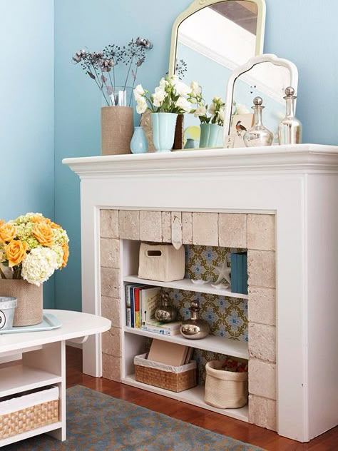 A bookcase inside a (non-working) fireplace. Genius! Cut Shelves, Unused Fireplace, Fireplace Bookshelves, Fake Fireplace, Fireplace Cover, Pretty Storage, Faux Fireplace, Diy Fireplace, Design Del Prodotto