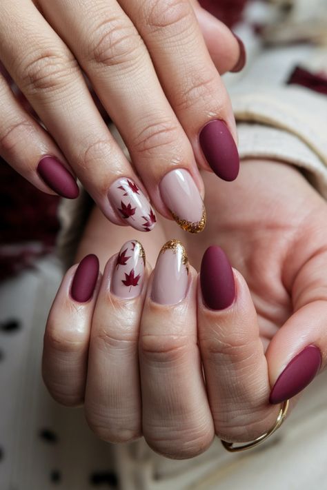 Embrace the beauty of the season with these chic Autumn short nails. Featuring a cozy mix of deep burgundy and shimmering gold accents, this stunning style captures the essence of fall perfectly. The rich colors evoke the changing leaves, making it a perfect choice for any autumn occasion. Transform your look with these delightful fall nail ideas and let your nails shine with seasonal elegance! #FallNailIdeas #AutumnNails #ChicNails #NailArt Short Nails Design Ideas 2024 Autumn, Maroon Autumn Nails, Thanksgiving Nails Burgundy, Elegant Fall Nail Art, Autumn Burgundy Nails, Fall Leaves Nails Design, Fall Nail Designs Leaves, Nail Design Ideas Fall, Autumn Design Nails