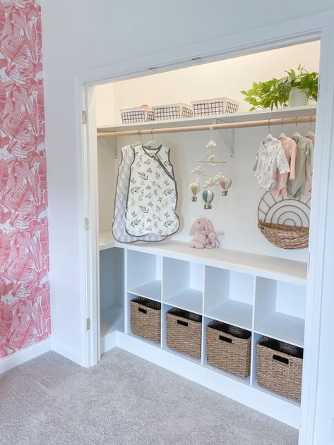 DIY Closet Makeover for Baby Girl's Nursery - Liz Pacini Wallpaper In Nursery Closet, Newborn Closet Ideas, Nursery Closet Sliding Doors, Nursery Closet Ideas Diy, Nursery Closet Without Doors, Nursery Open Closet Ideas, Nursery Storage Cubes, Nursery Closet Diy, Nursery Closet Doors