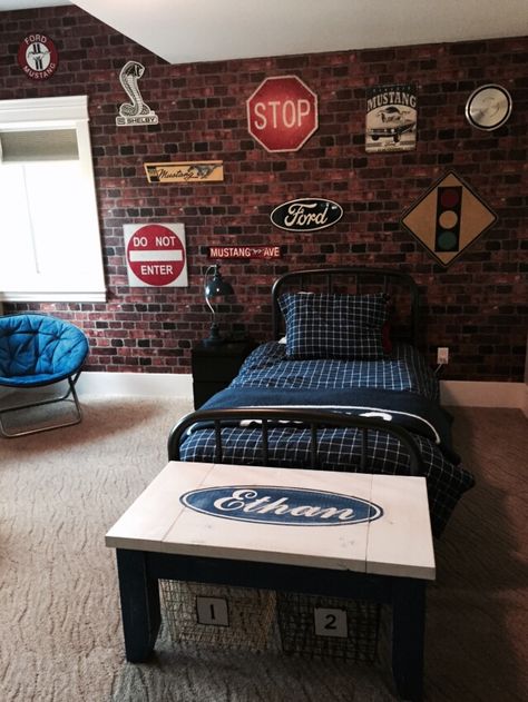 50 Teenage Boys Room Ideas and Designs We Love Street Themed Bedroom, Brick Wallpaper Bedroom Boys, Brick Wallpaper Boys Bedroom, Ford Bedroom Ideas, Road Signs Bedroom Decor, Vintage Car Room For Boys, Road Signs Bedroom, Car Room Ideas For Boys, Teenager Room Ideas For Boys