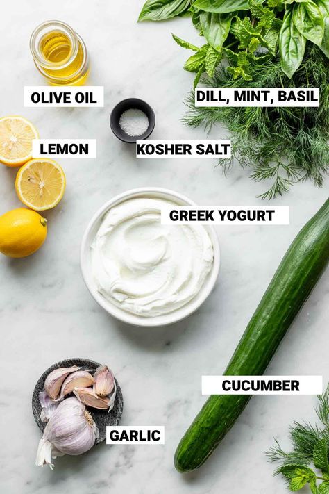 Our easy Tzatziki recipe is a cool and refreshing cucumber and yogurt sauce or dip. To make it, stir together Greek yogurt, cucumber, garlic, lemon, olive oil and herbs. Make it as a sauce for chicken, salmon, wraps or burgers or serve as a dip for pita or vegetables. When fresh cucumbers are in season it is time to make Tzatzki! This popular sauce from the Middle East and Greece is made from Greek yogurt, shredded and drained cucumber, garlic, and fresh herbs. Many recipes also call for a squee Greek Yogurt Cucumber Dip Tzatziki Sauce, How To Make Tziki Sauce, Tzatziki Seasoning Recipe, Turkish White Sauce, Greek Yogurt Tzatziki Sauce, Home Made Tzatziki Sauce, Healthy Tzatziki Sauce Greek Yogurt, Taziki Sauce Recipe Healthy Greek Yogurt, Easy Tzatziki Sauce Greek Yogurt