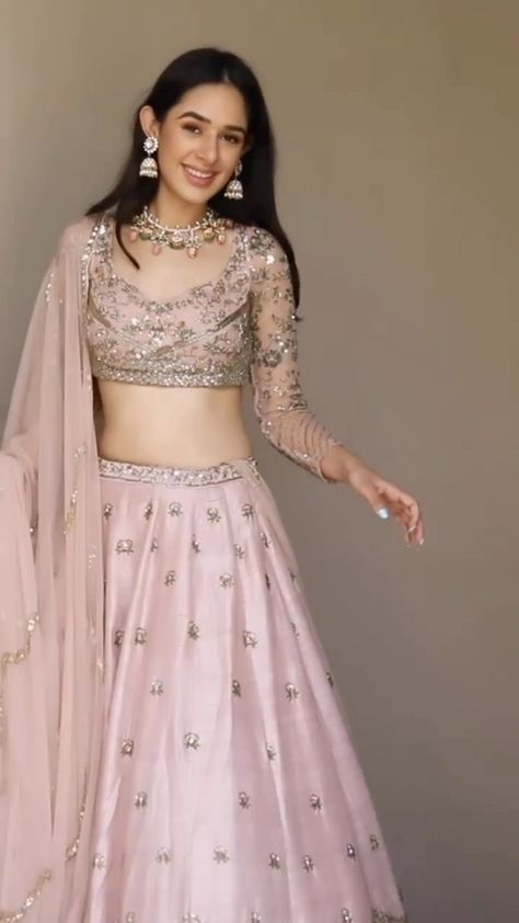 WeddingBazaar Fashion | Engagement or Sangeet - when would you wear this gorgeous pink lehenga 💕 . . Outfit @asthanarangofficial . . .✨ 𝐏.𝐒. 𝐖𝐞 𝐝𝐨𝐧’𝐭 𝐒𝐞𝐥𝐥… | Instagram Sangeet Lehenga Designs For Bride, One Sleeve Lehenga, Blouse Design For Lehenga Wedding, Lightweight Lehenga Designs, Bridesmaid Lehenga Look, Pastel Gharara Wedding, Party Wear Lehenga Blouse Designs, Latest Lehenga Blouse Designs Wedding, Simple Bridesmaid Lehenga