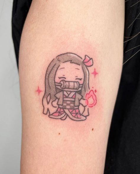 Tattoo by @pigeonpokes_ on Instagram, who is based in Singapore. Small Cute Japanese Tattoos, Cute Anime Tattoos For Women, Small Pokemon Tattoo Simple, Small Nezuko Tattoo, Subtle Naruto Tattoos, Anime Tattoo For Women, Anime Tattoos Women, Demon Slayer Nezuko Tattoo, Minimal Anime Tattoo