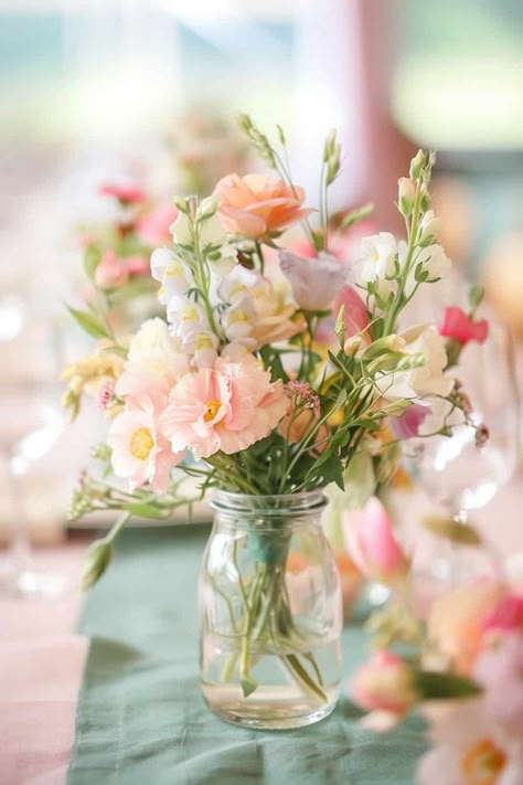 20 Beautiful Wildflower Centerpieces For Any Event • Spring Flower Table Centerpieces, Confirmation Decorating Ideas Pink, No Candle Wedding Centerpieces, Small Mason Jar Flower Arrangements, Wedding Round Table Flowers, Table Pieces For Wedding, Round Table Flower Arrangements, Floral Centerpieces For Party, Diy Table Centerpieces For Party