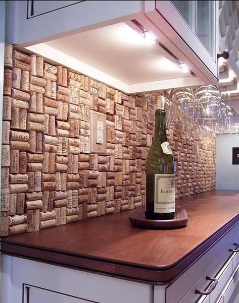 Wine lovers can enhance their kitchens with creative backsplashes that showcase decorative corks. These corks are easy to stick on the walls and are budget-friendly, offering a stylish look in modern settings. The sky's the limit when it comes to unique kitchen backsplash ideas. Creative Kitchen Backsplash, Wine Cork Diy Projects, Cork Diy Projects, Backsplash Diy, Wine Cork Ideas, Wine Cork Diy Crafts, Wine Cork Projects, Diy Decoration Ideas, Wine Cork Diy