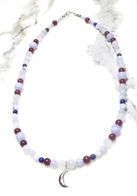 This semi-precious necklace is made with Grade AAA Rubies, Grade A+ (6mm-7mm), Grade B+ (5mm-6mm) Rainbow Moonstone, Grade A Lapis Lazuli, Grade AA Chalcedony Blue Lace Agate (3mm), Grade AA (6mm), and Grade AAA (8mm) Blue Lace Agate. www.Etsy.com/shop/JohnsLoveBeads Silver Lapis Lazuli Necklace With Gemstone Beads, Blue Lapis Lazuli Beaded Gemstone Necklace, Lapis Lazuli Amulet Necklaces With Gemstone Beads, Blue Lapis Lazuli Round Beads Crystal Necklace, Blue Lapis Lazuli Crystal Necklace With Faceted Beads, Semi Precious Necklace, Gemstone Beaded Necklace, Blue Lace Agate, Blue Lace