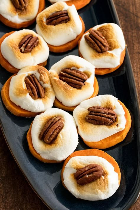 Sweet Potato Bites   INGREDIENTS  3 to 4 medium sweet potatoes, peeled and sliced into 1/4-inch-thick rounds 2 tbsp.  melted butter 1 tsp. maple syrup Kosher salt 1 (10-oz.) bag marshmallows 1/2 c. pecan halves  DIRECTIONS  Preheat oven to 400°. On a large baking sheet, toss sweet potatoes with melted butter and maple syrup and arrange in an even layer. Season with salt.   Bake until tender, flipping halfway through, about 20 minutes. Remove baking sheet from oven and switch oven to broil. Appitizer Ideas, Sweet Potato Bites, Best Thanksgiving Appetizers, Thanksgiving Appetizer, Sweet Potatoe Bites, Thanksgiving Appetizer Recipes, Fall Appetizers, Nigel Slater, Potato Bites