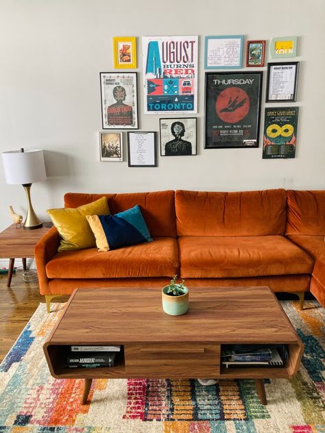 Retro Front Room Ideas, Orange Mid Century Sofa, Rustic Orange Couch Living Room, Mid Century Modern Living Room Orange Couch, Russet Couch Living Room, Living Room Designs Orange Sofa, Orange Sofa Living Rooms, Room With Orange Couch, Orange Couch Pillows