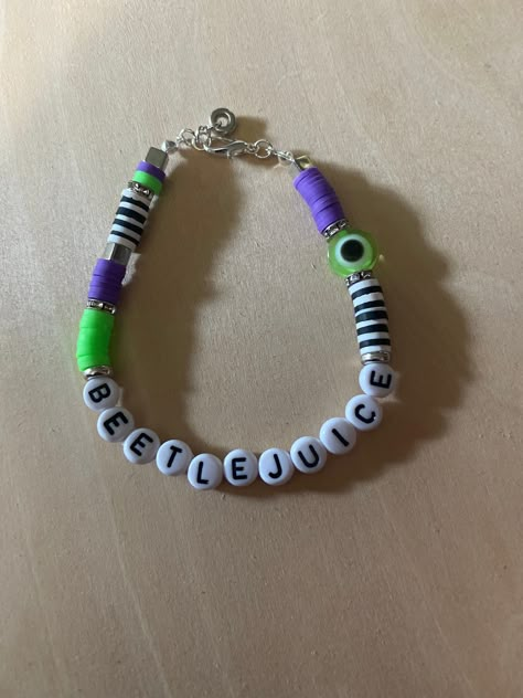 Handmade beetlejuice bracelet Beetle Juice Bracelets, Beetlejuice Bracelet, Beetlejuice Broadway, Clay Bracelet Ideas, Handmade Jewelry Display, Colorful Bead Bracelets, Diy Kandi Bracelets, Make The Friendship Bracelets, Cool Bracelets