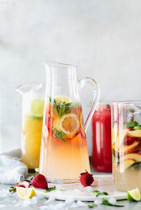 PITCHER COCKTAIL RECIPES: Classic Pitcher Margaritas, Strawberry Lemonade Basil Fizz, Peach Elderflower Gin Pitcher, and a Watermelon Mojito Mocktail Pitcher Cocktail Recipes, Pitcher Margaritas, Pitcher Ideas, Peach Cocktail Recipe, Pitcher Margarita Recipe, Cocktail Recipes For A Crowd, Easy Margarita Recipe, Pitcher Drinks, Pitcher Cocktails