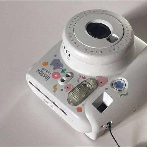 Instax polaroid with aesthetic cute stickers. Instagram aesthetic white filler picture. White Instax Camera Aesthetic, Polaroid Camera With Stickers, Polaroid Camera Decoration, Decorating Polaroid Camera, Instax Liplay Aesthetic, Camera With Stickers Aesthetic, Instax Printer Aesthetic, Aesthetic Instax Camera, Instax Mini 9 Aesthetic