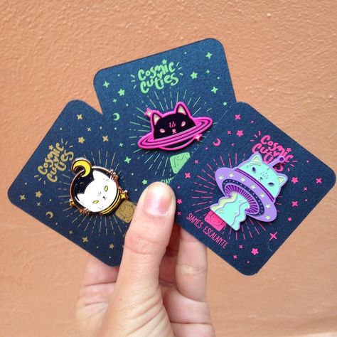 My paper supplier discontinued my beloved holographic paper  I had to make new backing cards for my pins. They're sparkly tho  remember to click the link in my bio to purchase! Pin Card Design, Backing Card Design, Pin Backing Card, Enamel Pin Design, Holographic Paper, Pins And Buttons, Enamel Pin Collection, Jacket Pins, Pin Game