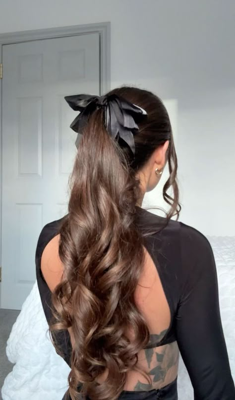 Show off your bold style with these beautiful hair ideas that are sure to turn heads. #BoldHair #BeautifulHair #HairStyleInspo Black Bow Ponytail, Ponytail Curls Hairstyles, Curled Hair In Ponytail, Elegant School Hairstyles, Ponytail Hairstyles For Wavy Hair, Formal Hairstyles With Bow, Bow With Ponytail, Ponytail With A Bow, Curly Ponytail With Bow