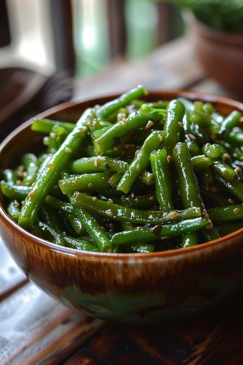 Green beans seasoned with sesame seeds in a wooden bowl. Tasty Green Beans Recipe, Seasonings For Green Beans, Sauted Green Bean Recipe, Recipes For Green Beans Side Dishes, Dark Green Vegetables Recipes, Perfect Green Beans, Sauteed Frozen Green Beans, Skillet Green Beans Easy, Cooking Fresh Green Beans On Stove